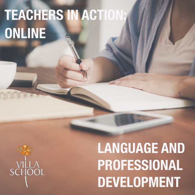 Young business woman in white dress sitting at table in cafe and